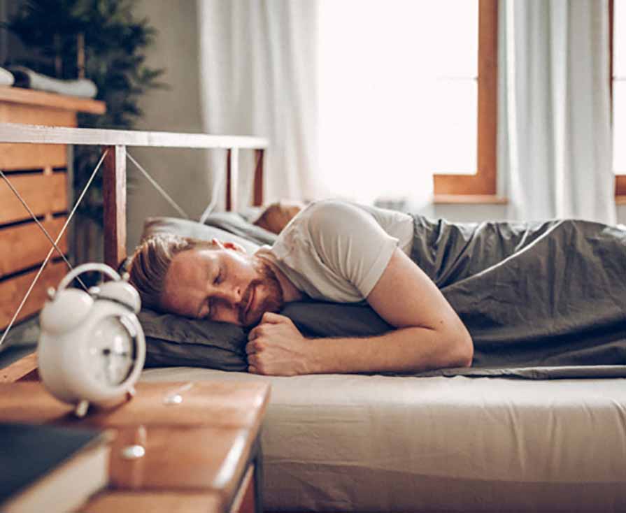 White Man Sleeping In Bed